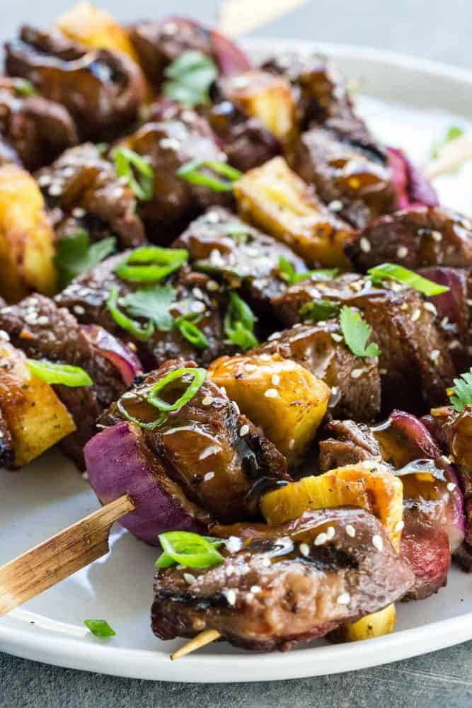 Teriyaki Beef Skewers on a white plate. 