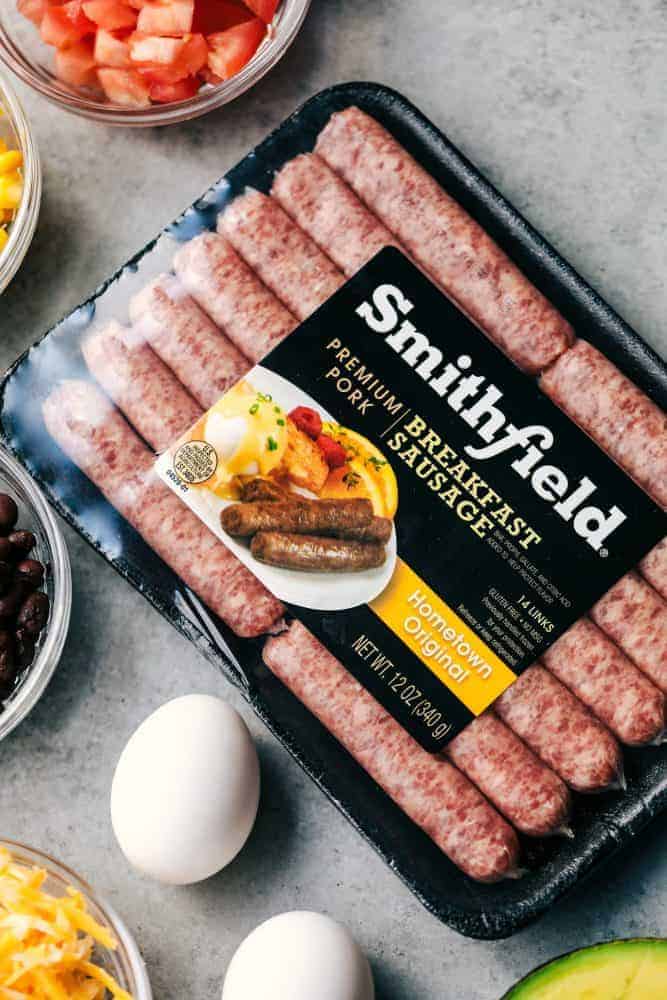 A package of Smithfield Sausage and two un-cracked eggs. 