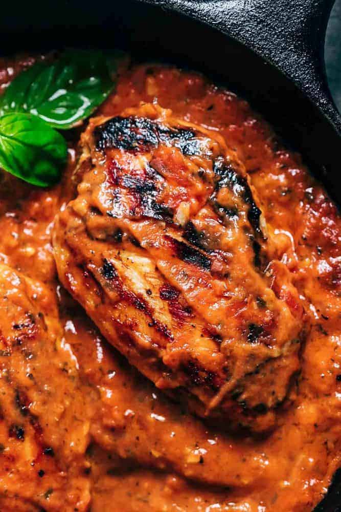 Closeup of creamy tomato basil chicken.