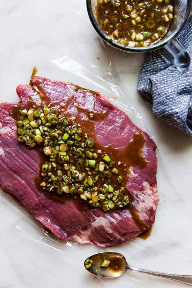 Brown Sugar Garlic sauce on un-cooked flank steak. 