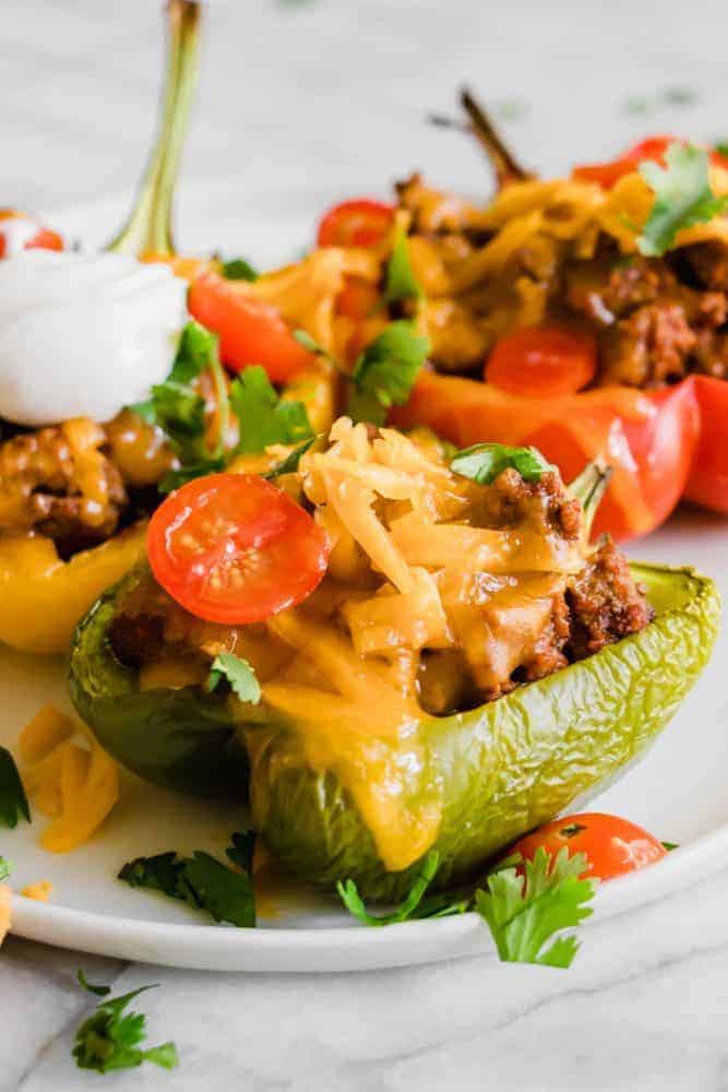 Taco Stuffed Peppers on a white plate. 