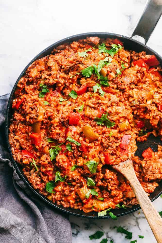 Unstuffed Pepper Skillet in a skillet with a wooden spoon. 