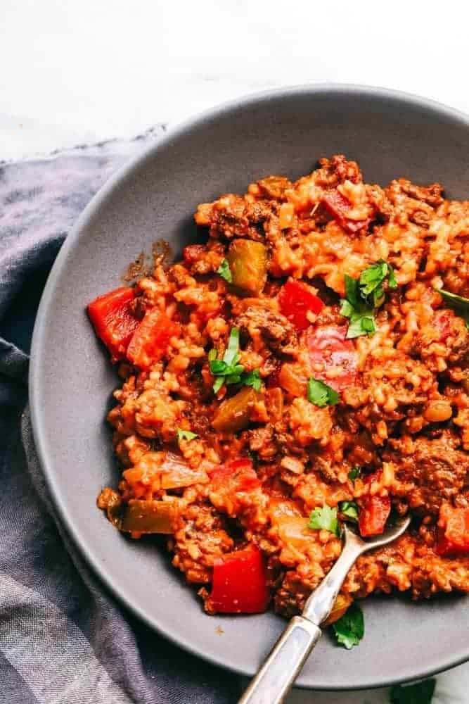 Unstuffed Pepper Skillet in a grey bowl with a metal spoon. 