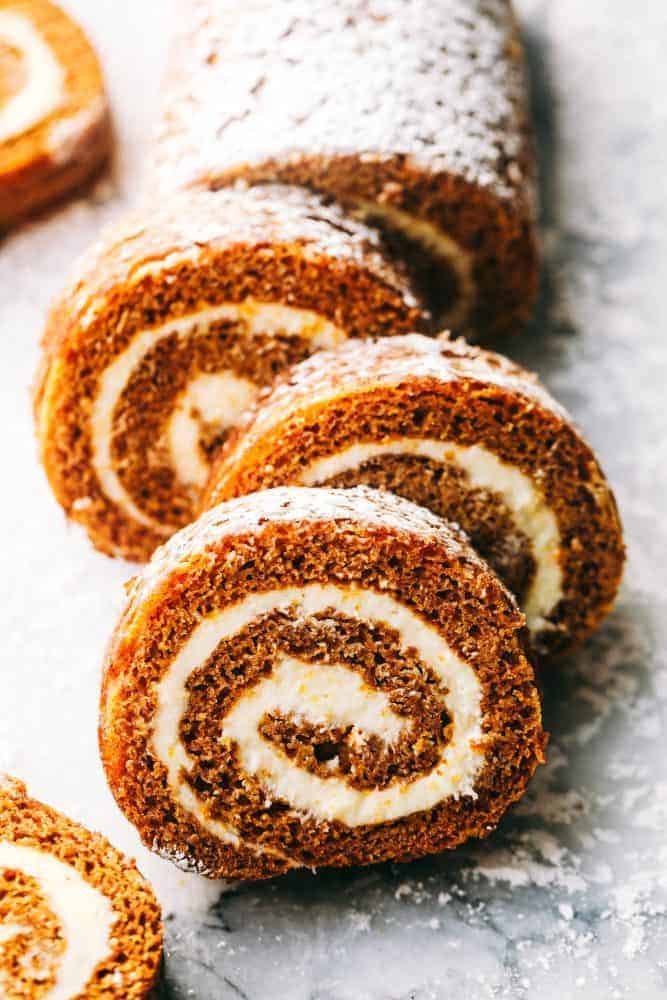 Pumpkin Roll cut up with powdered sugar sprinkled on top. 