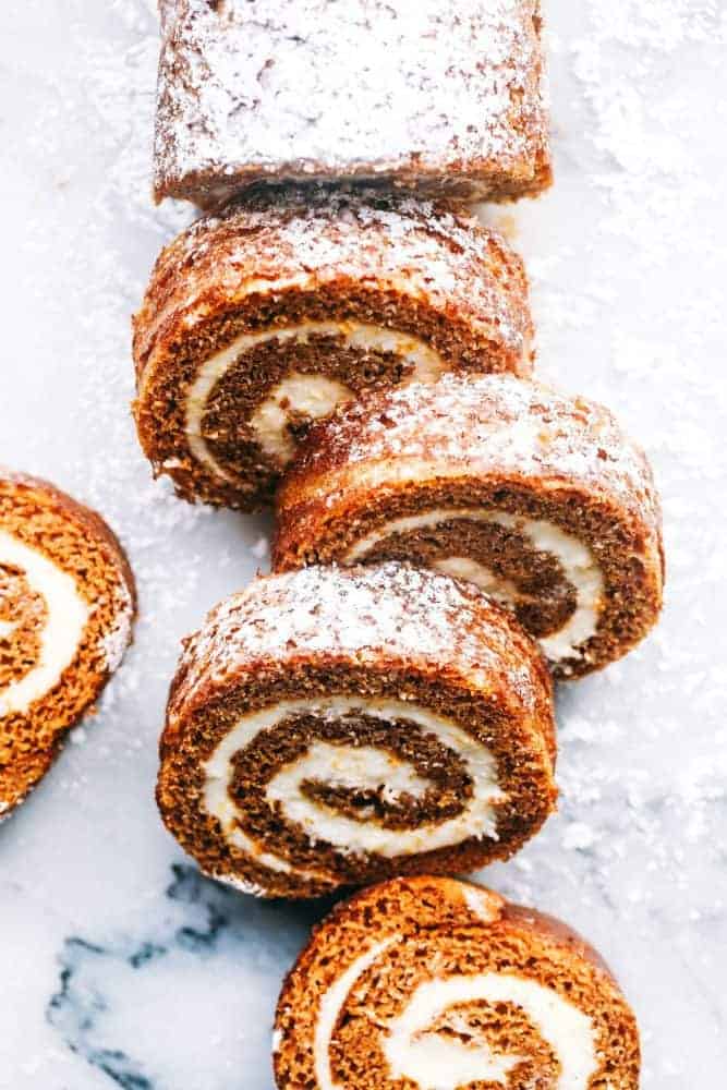 Sliced Pumpkin Roll with powdered sugar on top. 