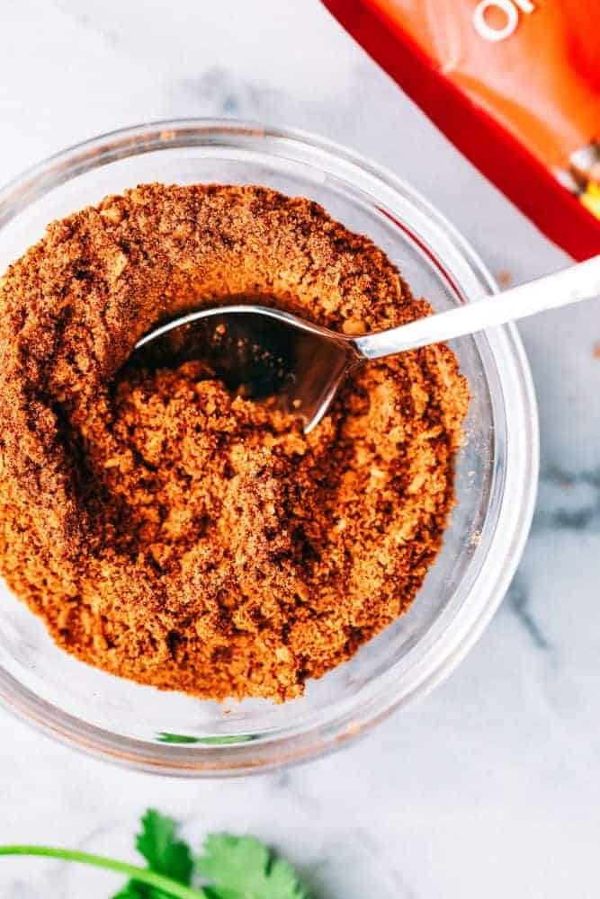 Taco seasoning in a clear glass bowl. 