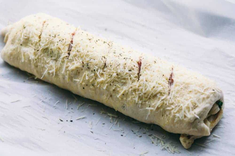 Uncooked Ham and Swiss Stromboli rolled up and ready for the oven. 