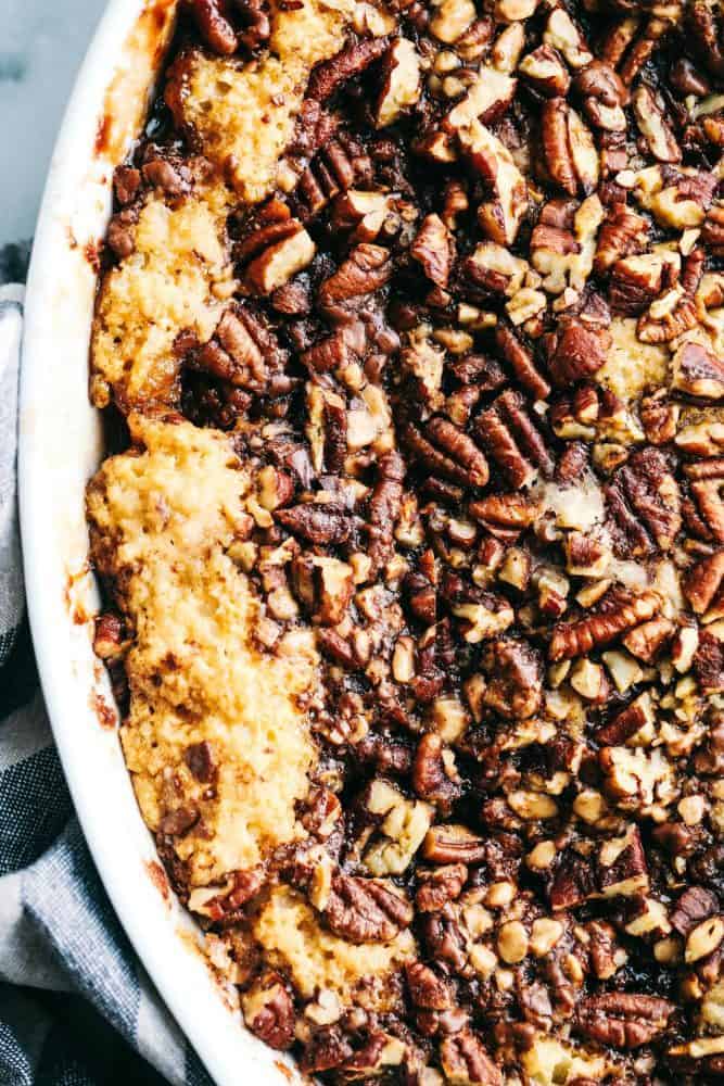 Close up of Pecan Pie Cobbler in a white dish. 