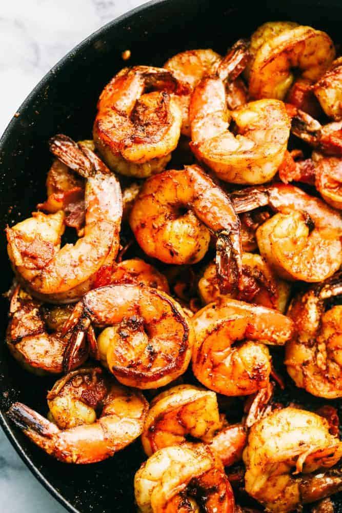 Close-up of Cajun garlic shrimp in a skillet. 