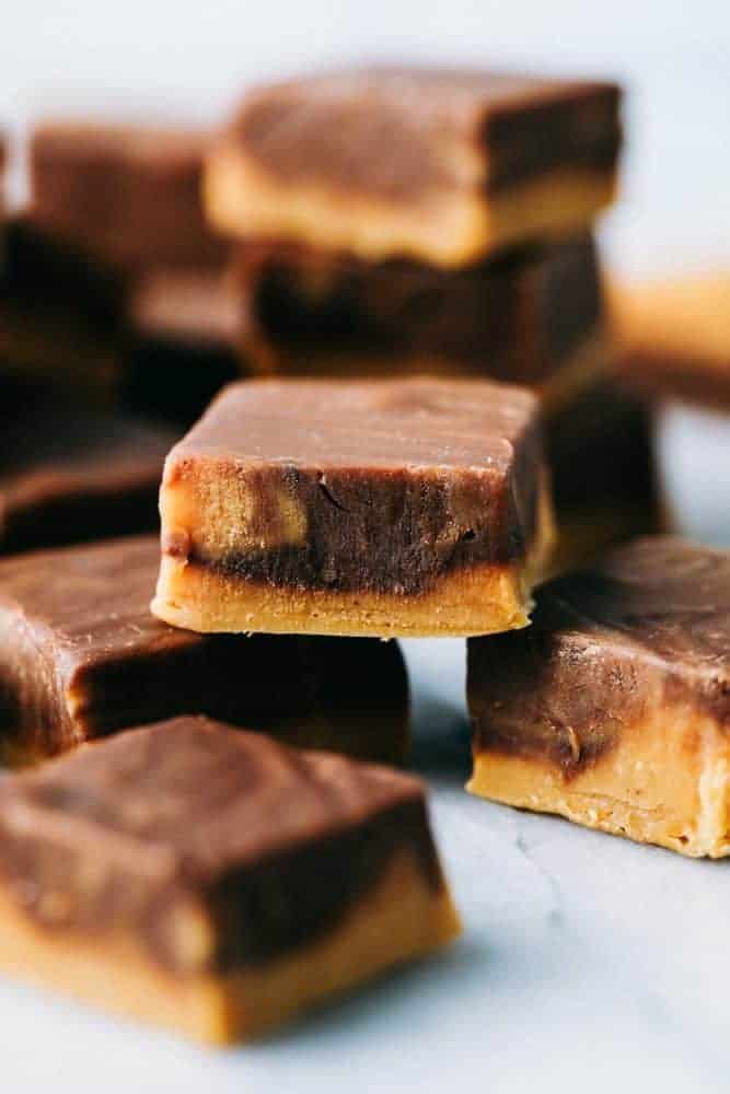 Peanut butter chocolate fudge stacked on top of each other.