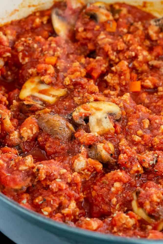 close up photo of meat sauce in a pan