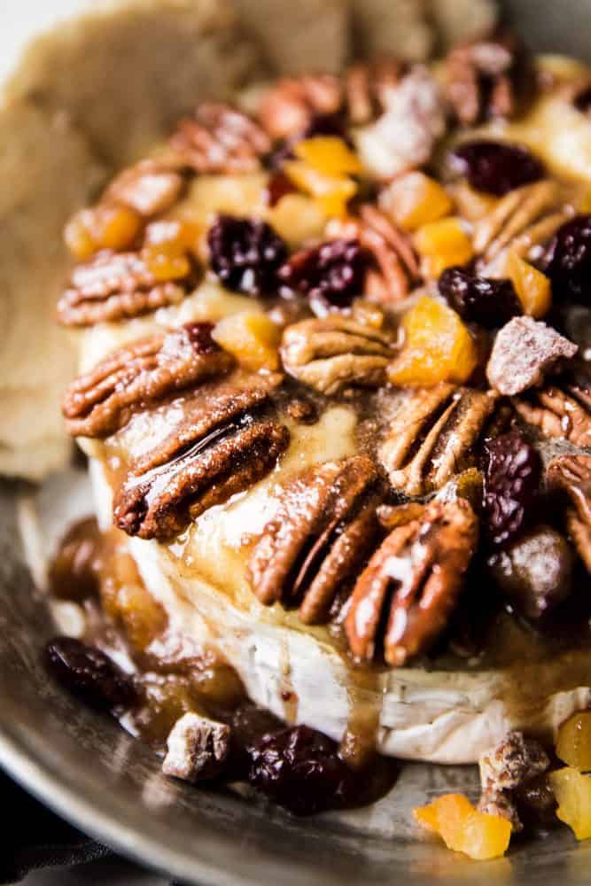 Maple pecan baked brie and a serving dish with chips on the side.