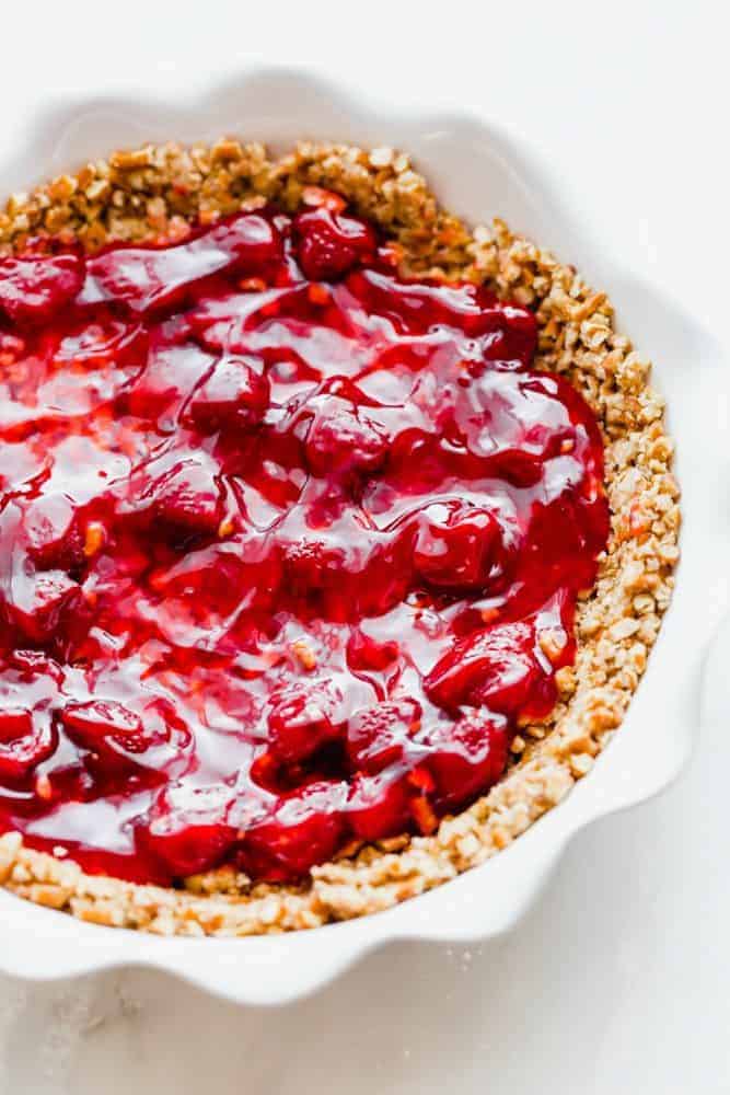 Strawberry peanut butter pie in a white pie pan.