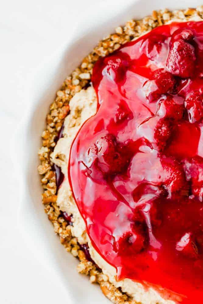 Close up photo of strawberry peanut butter pie in a white pie pan.