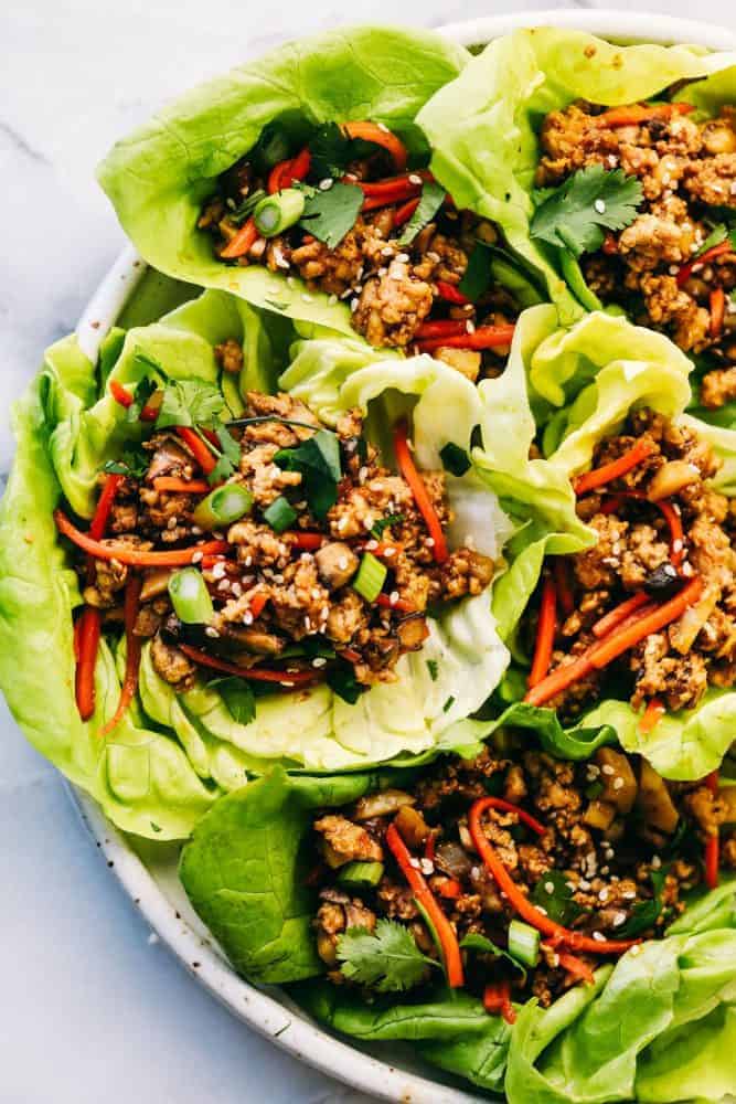 Asian turkey lettuce wraps on a white plate. 