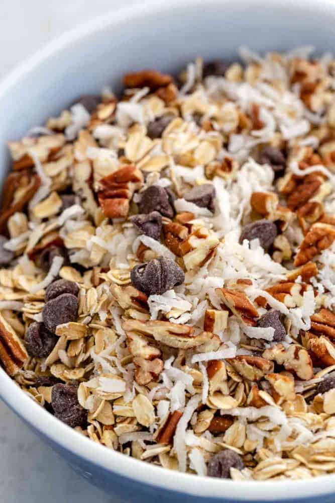 Dried ingredients and chocolate chips in a mixing bowl.