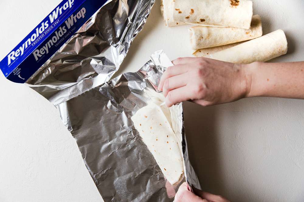 Wrap the burrito in aluminum foil.