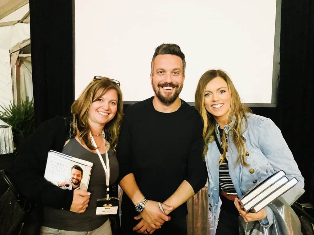 Alyssa taking a picture with Fabio Viviani.