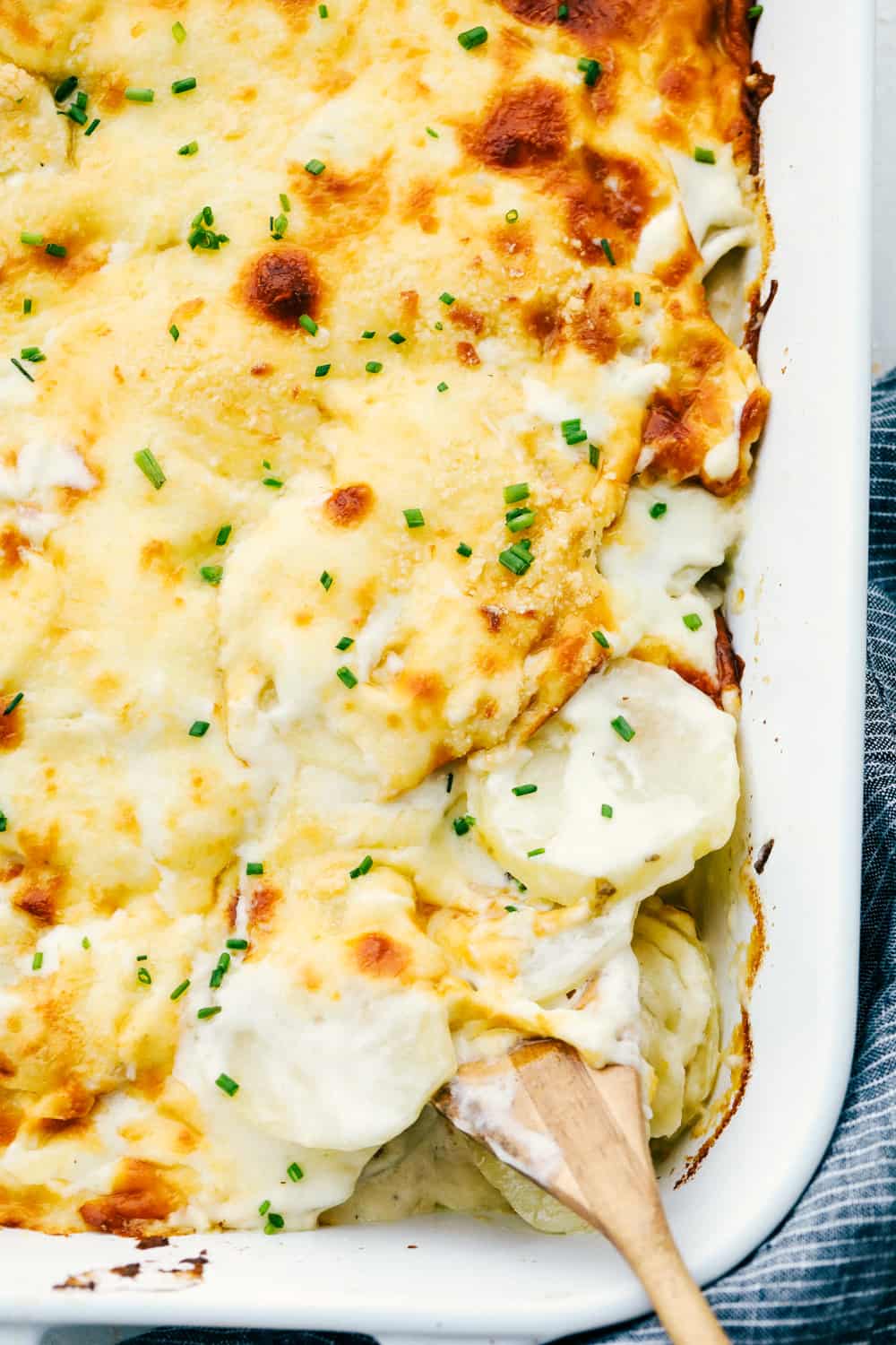 Cheesy, tender savory scalloped parmesan potatoes.