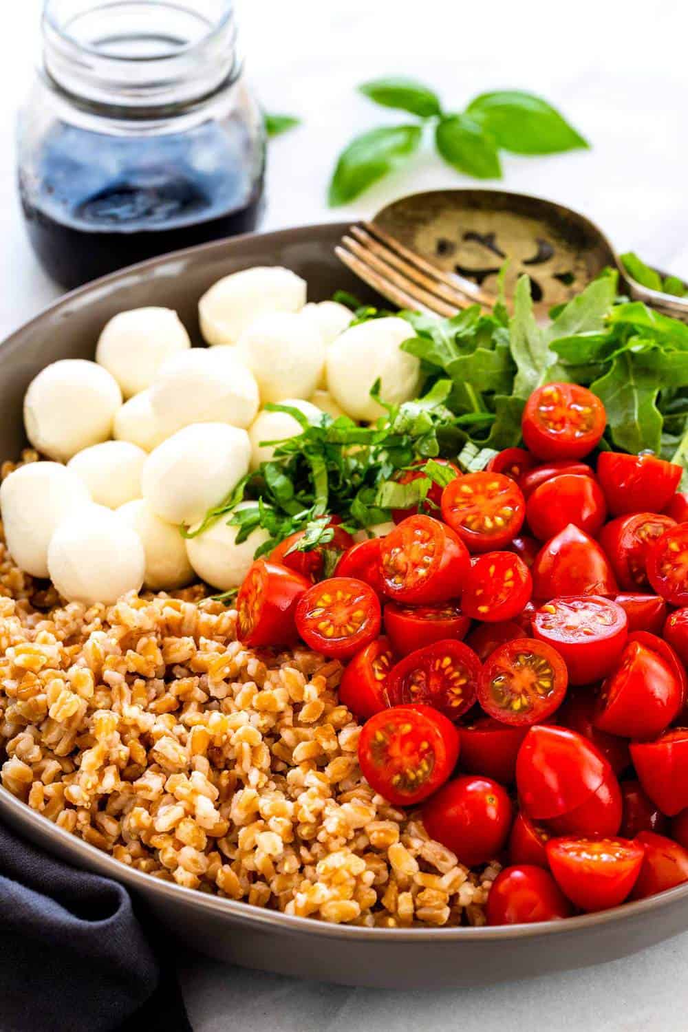 Farro Caprese Salad ingredients in a bowl