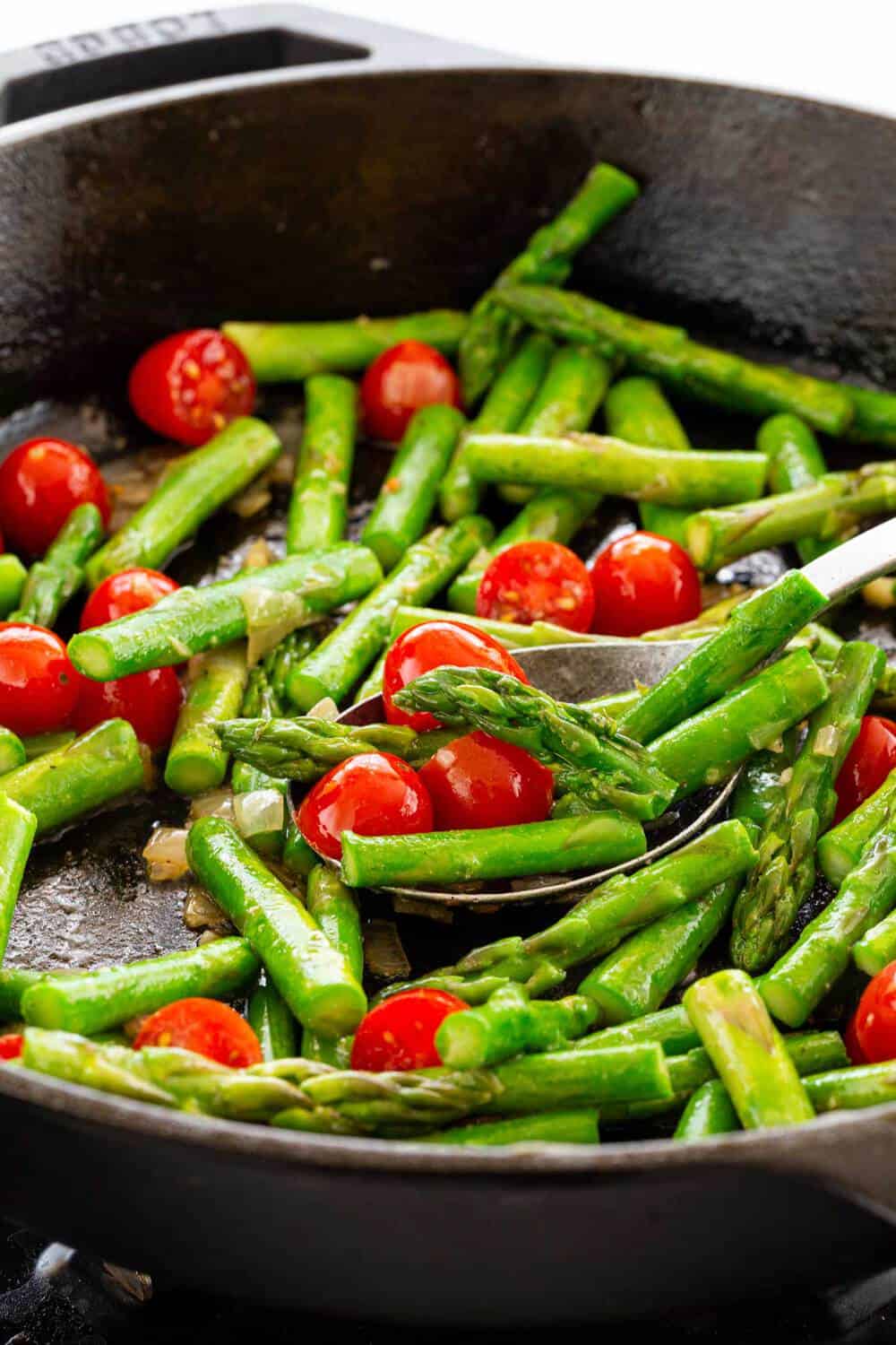 asparagus cooking in a skillet