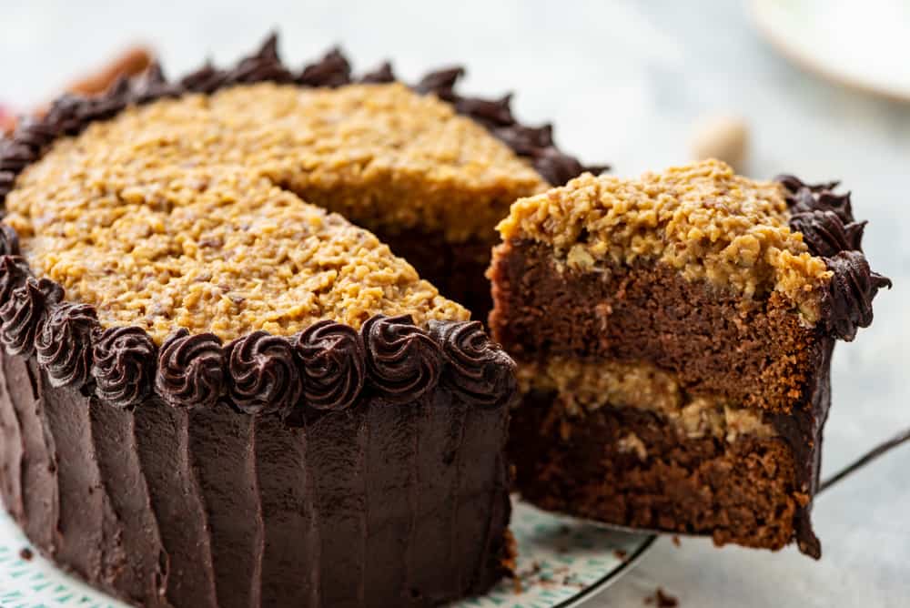 Cutting a slice of Homemade German Chocolate Cake.