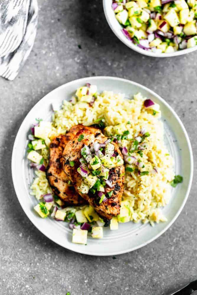 This Grilled Chipotle Chicken with Pineapple Salsa on a white plate.