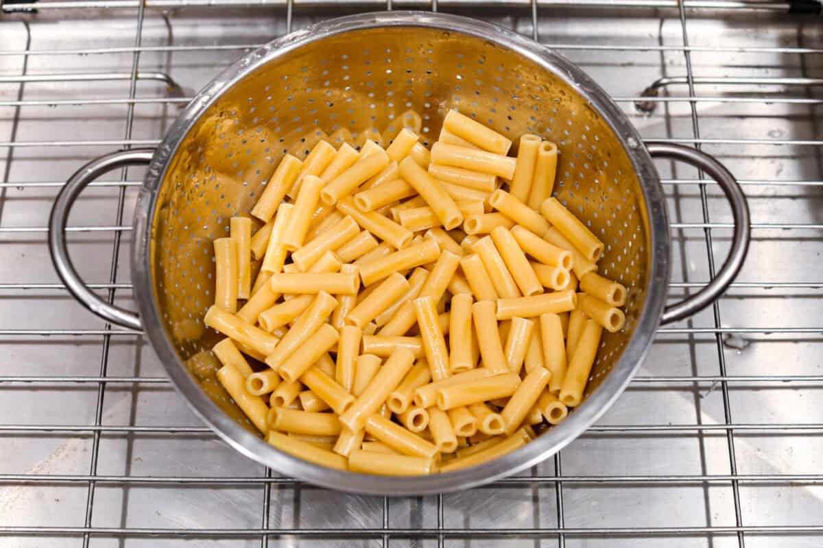 Overhead shot of cooked pasta in a colander. 