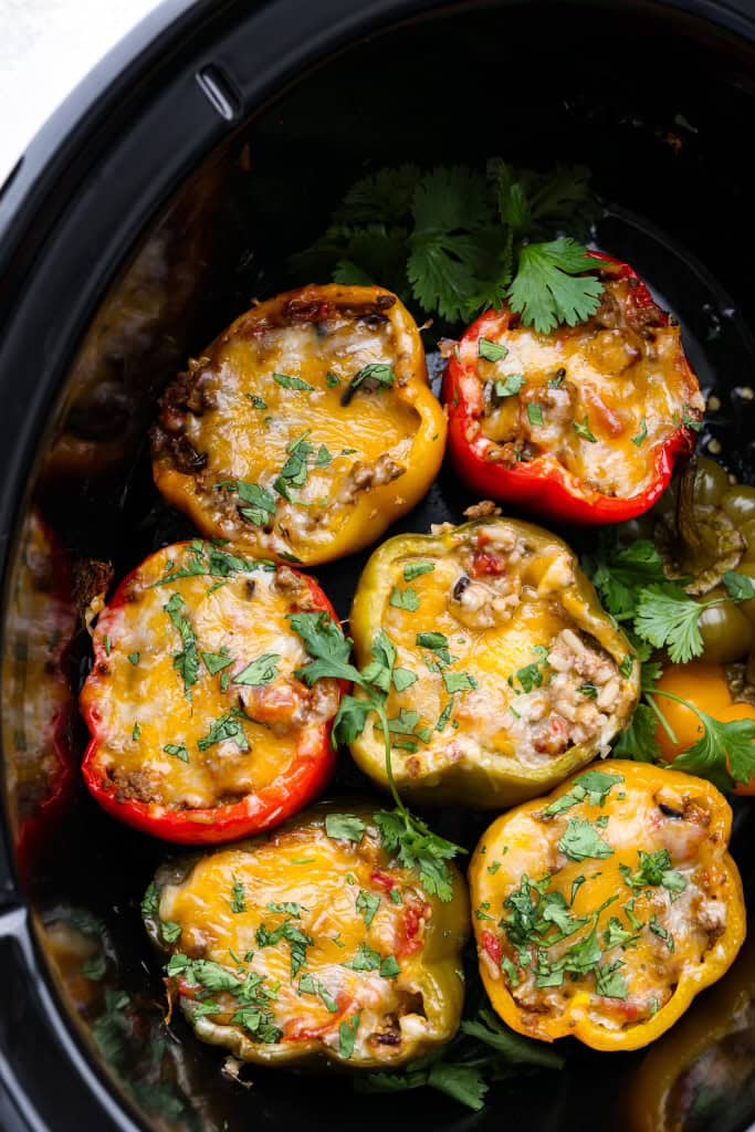 Overhead shot of slow cooker stuffed bell peppers.