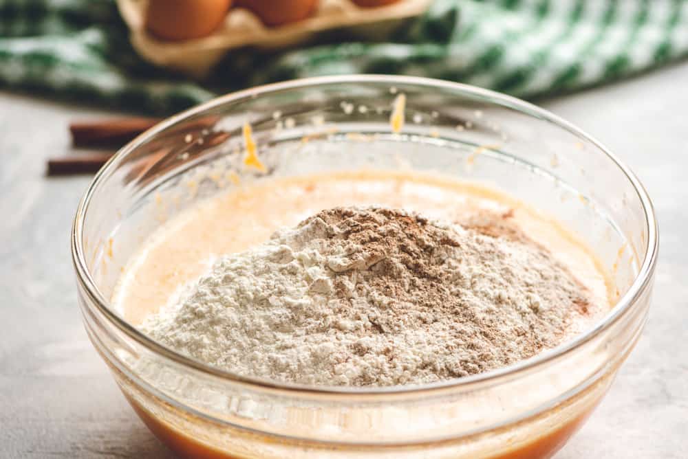 Pumpkin cake ingredients in a. bowl