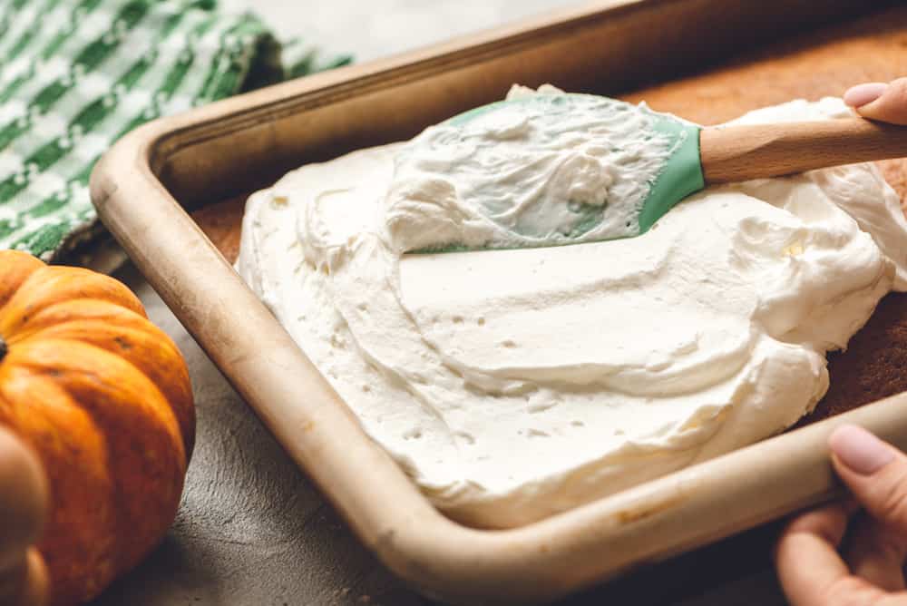 Pumpkin cake with whipping cream in a bowl