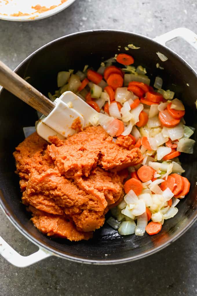 mixing of pumpkin soup in a pot