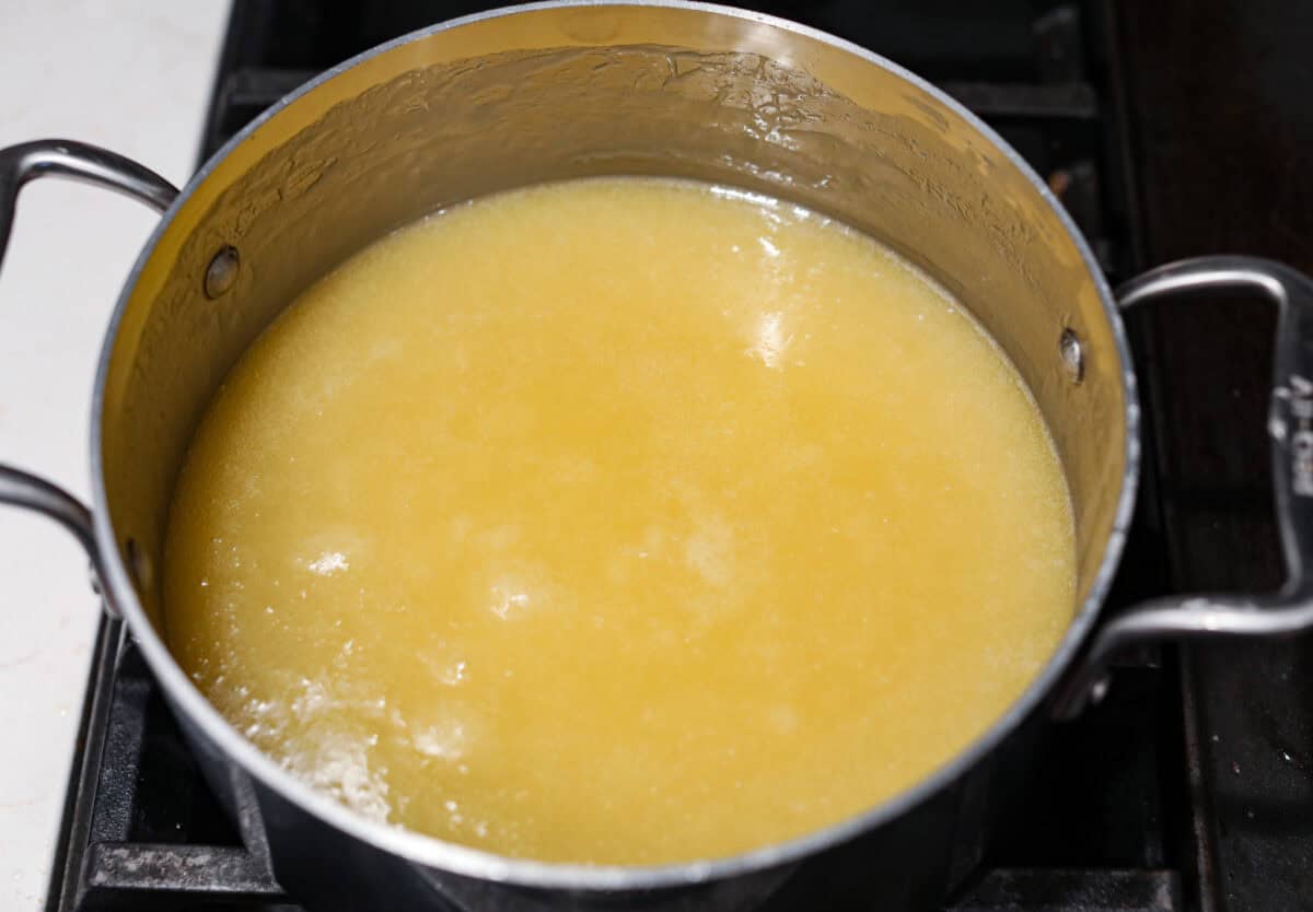 Overhead shot of the sugary syrup mixture cooling in the pan on the stove. 