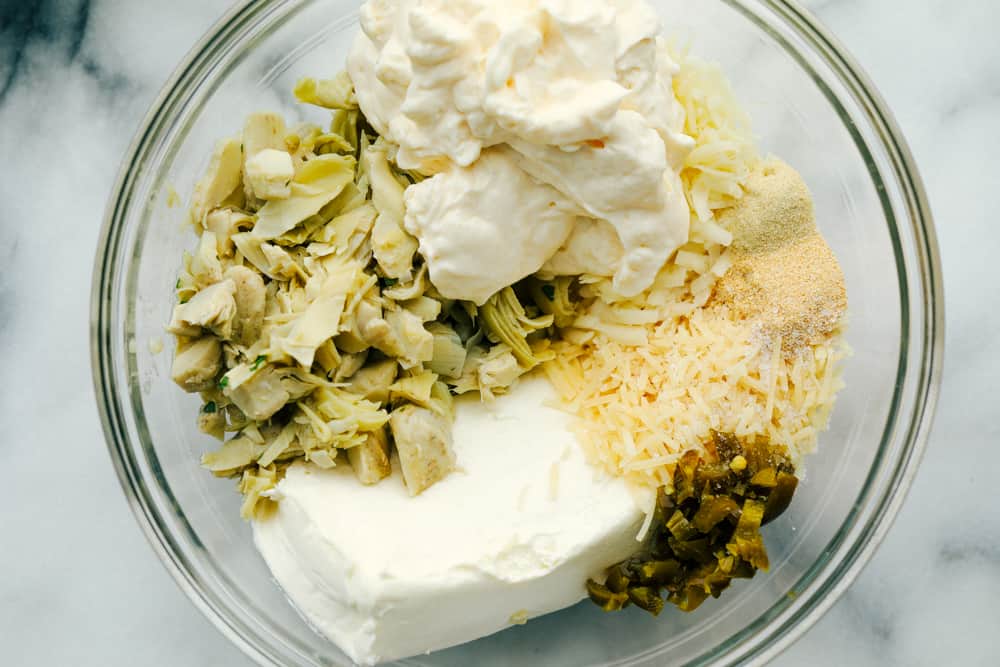 Jalapeno artichoke dip ingredients in one bowl. 