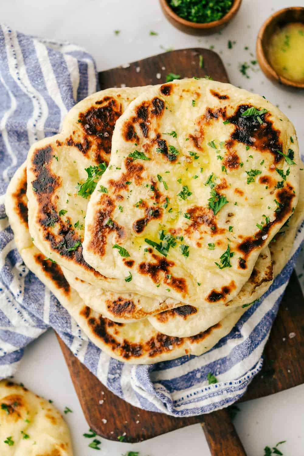 Overhead shot of naan bread stacked together. 