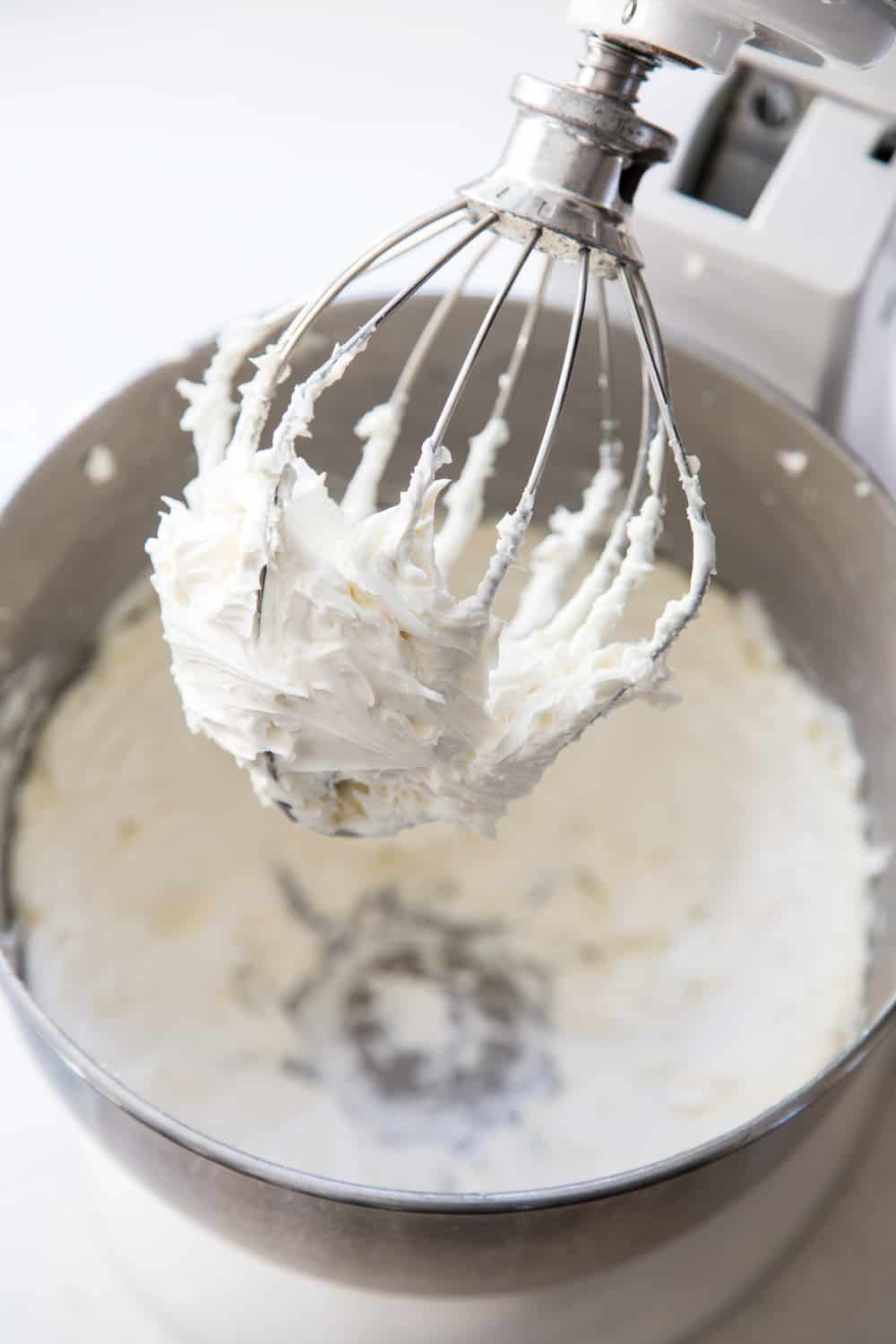 Vanilla buttercream frosting in a stand mixer bowl