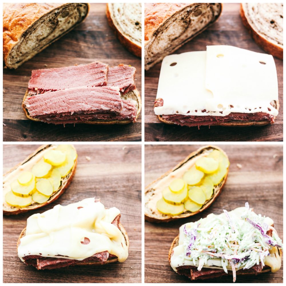 Making a corned beef sandwich with corned beef, cheese, pickles and coleslaw. 