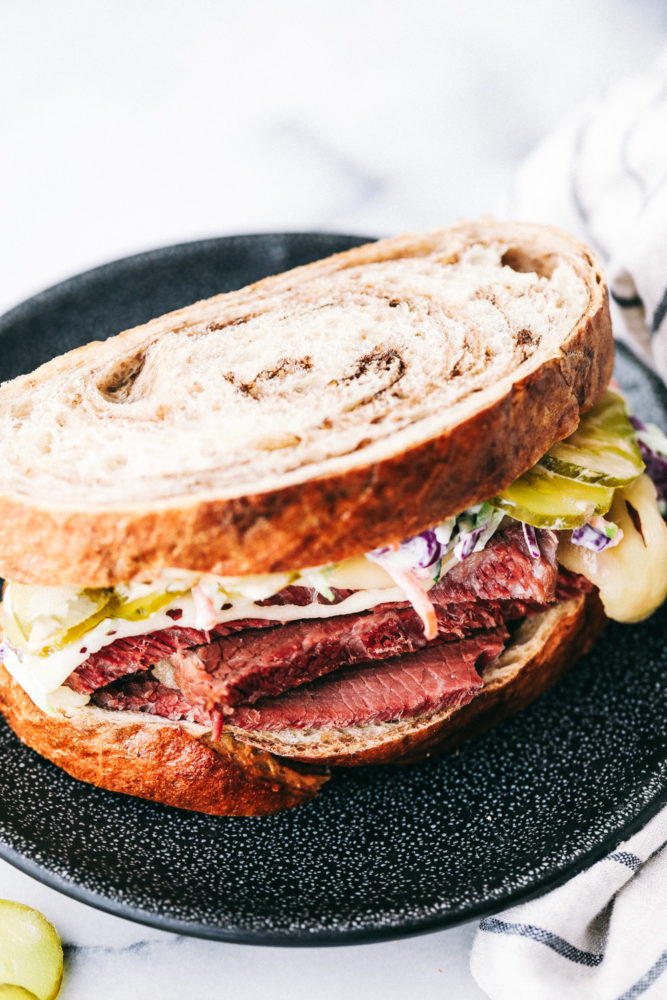 A corned beef sandwich on a plate. 