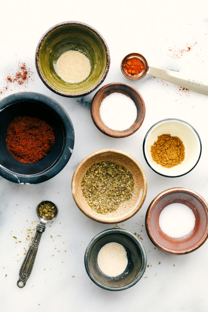 All the seasonings placed in separate bowls. 