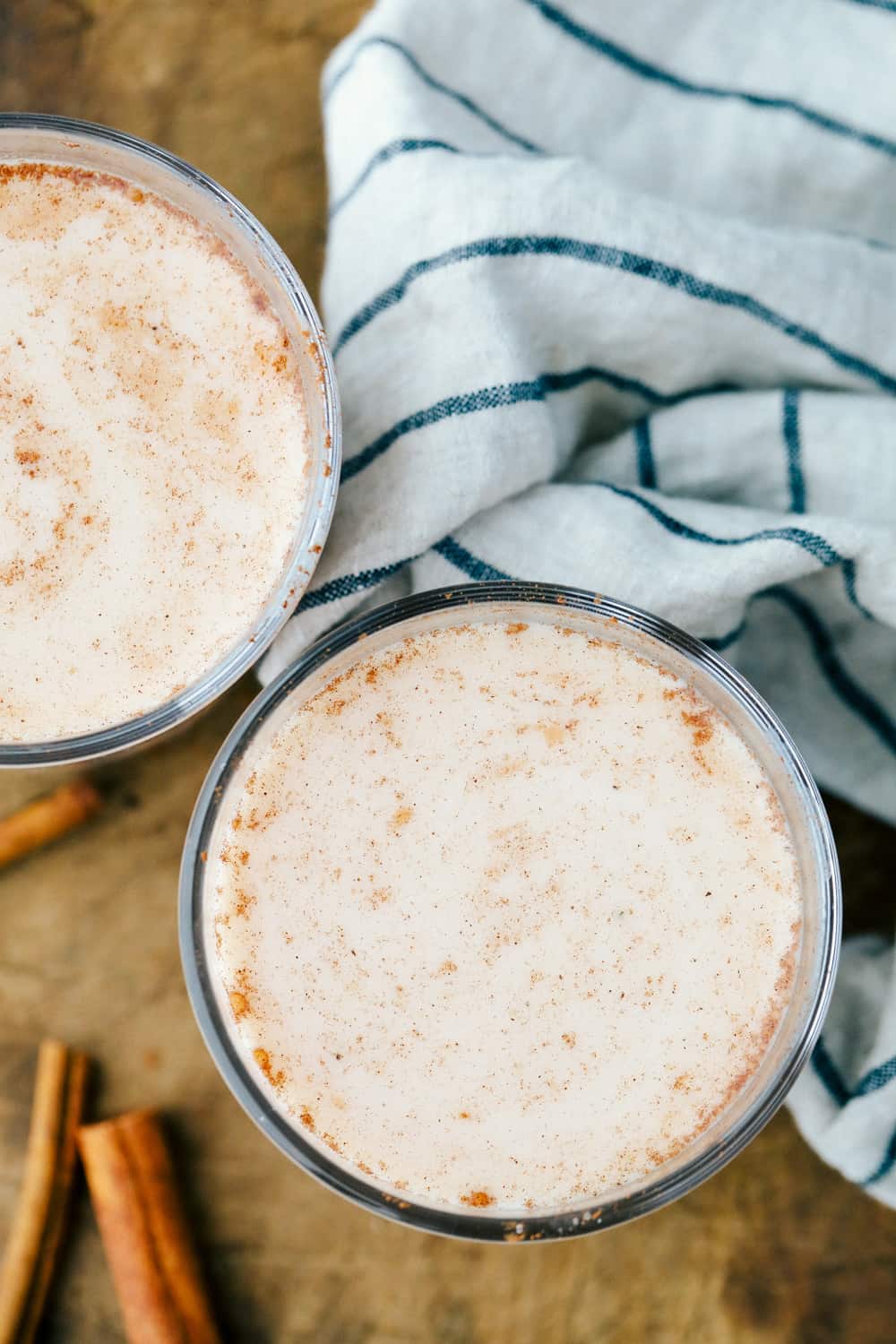 A photo of the top of the glass cup with horchata in it sprinkled cinnamon. 