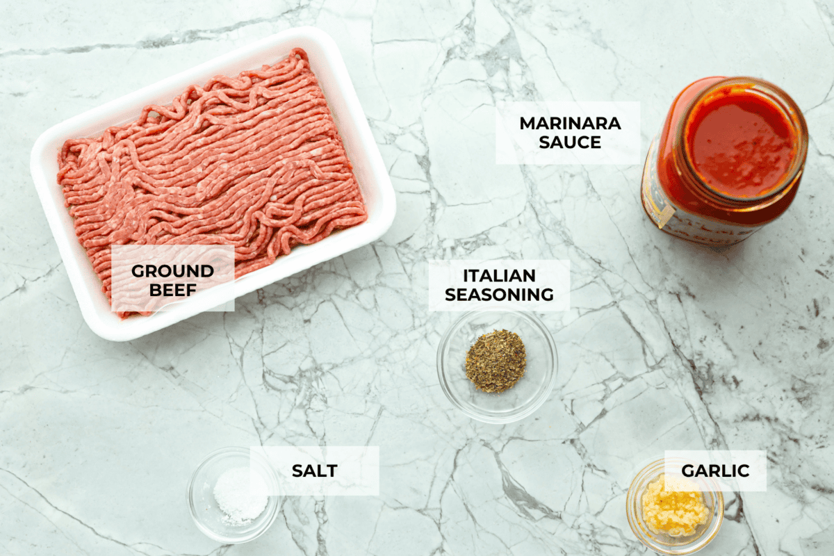 Overhead shot of labeled meat sauce ingredients. 