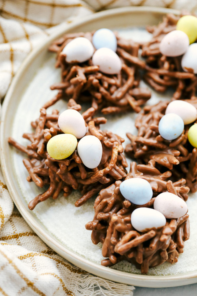 A plate full of birds nest with Cadbury eggs on top. 