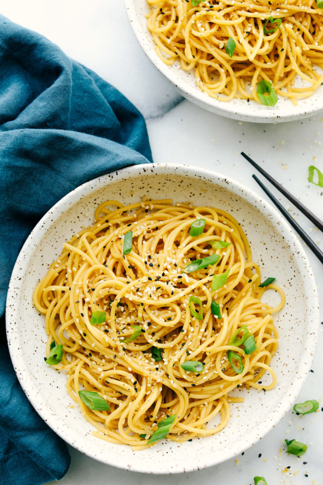 Overhead photo shot with Garlic sesame noodles in a bowl.