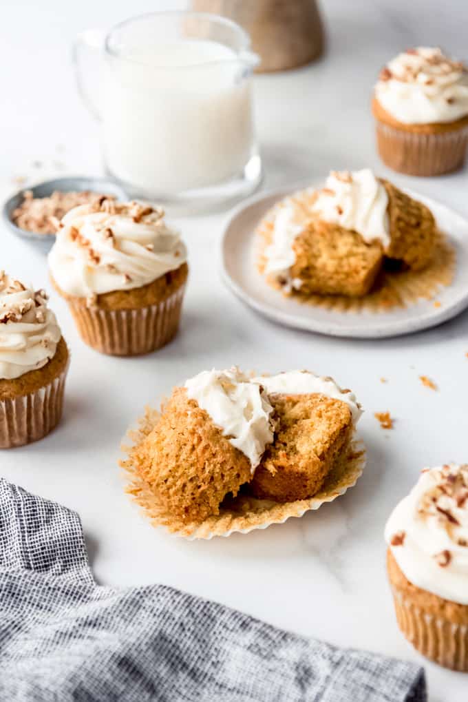 An image of homemade carrot cake cupcakes with cream cheese frosting.