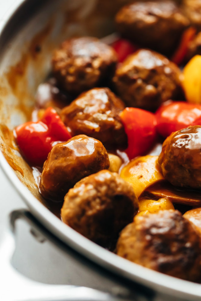 Closeup of Sweet and sour meatballs in a skillet