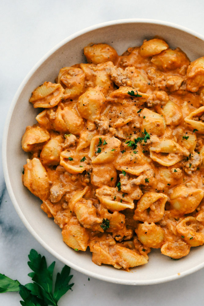 Cheesy beef and shells in a bowl. 