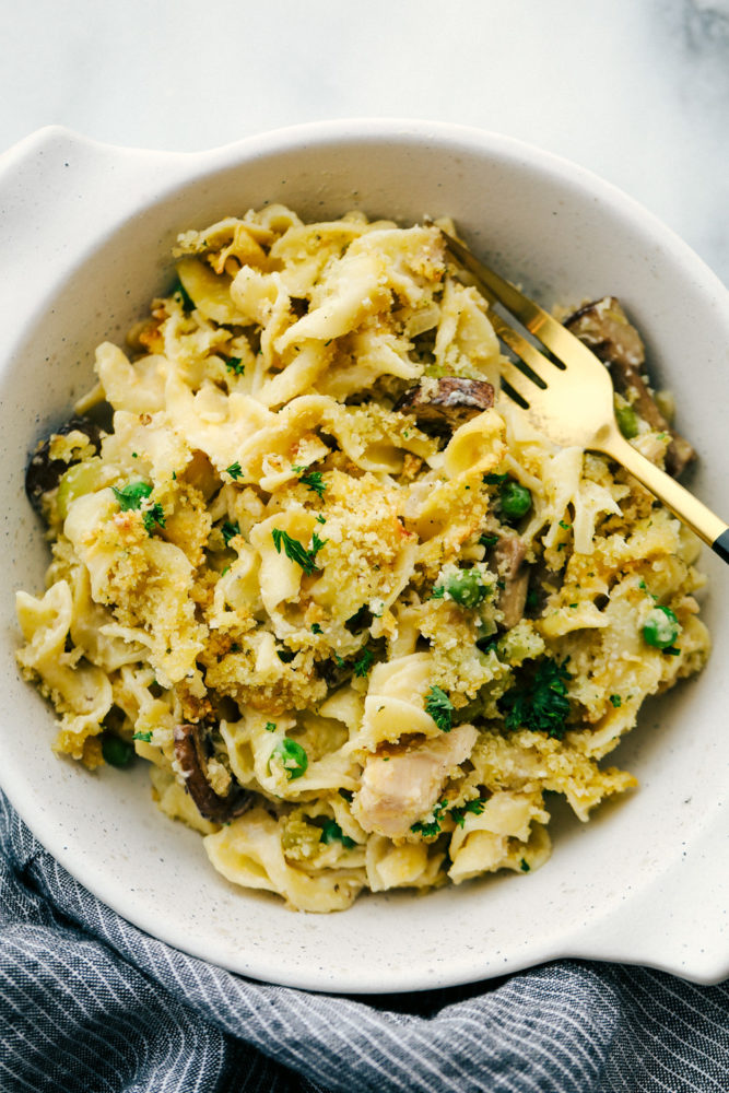 Tuna noodle casserole in a bowl with a fork r