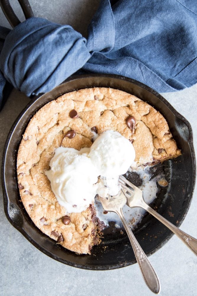 Pizookie with ice cream in a cast iron skillet