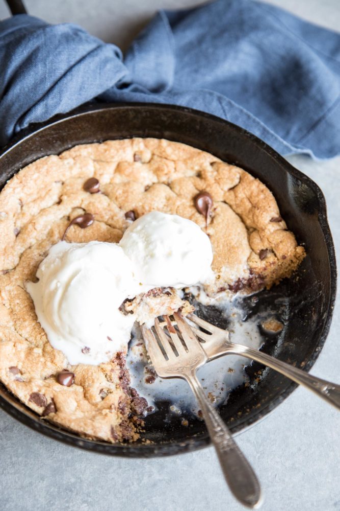 Pizookie with ice cream in a cast iron skillet