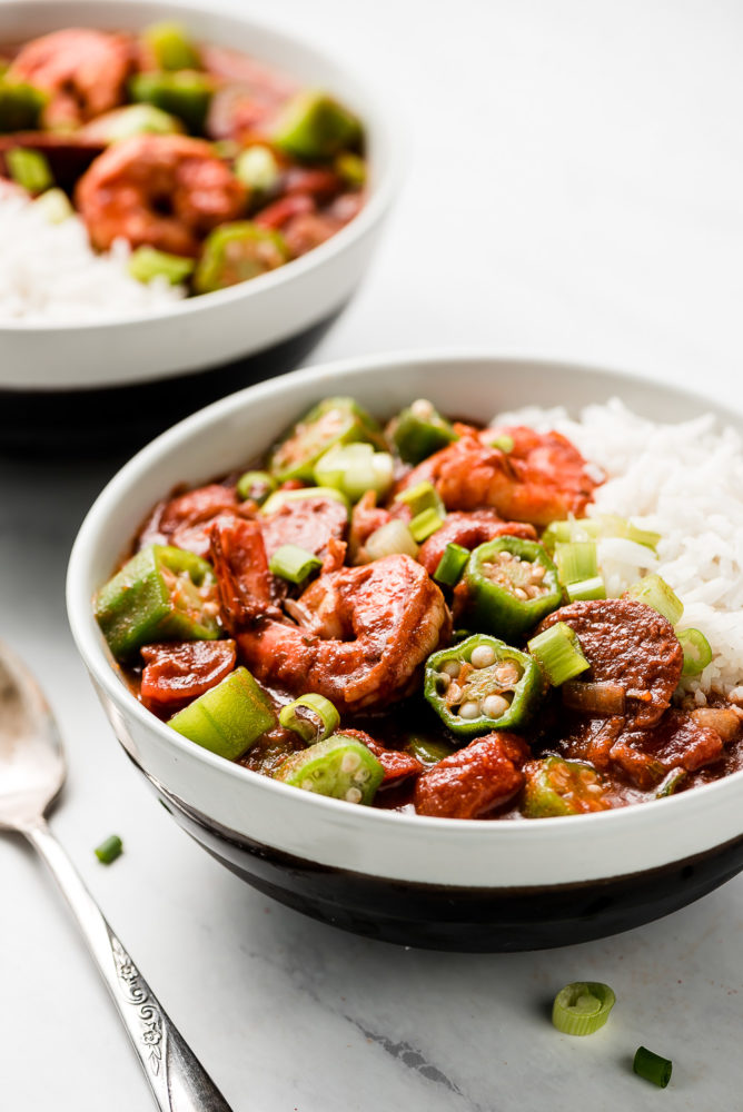 A bowl of shrimp, sausage, and okra gumbo over rice.